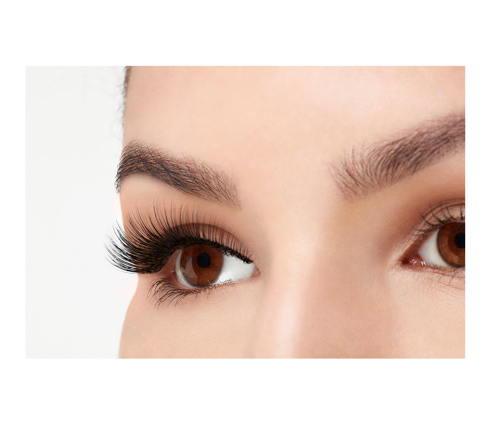 A model wearing Ardell 3D Faux Mink 857 in a side view emphasizes the curly, flared & natural lash look