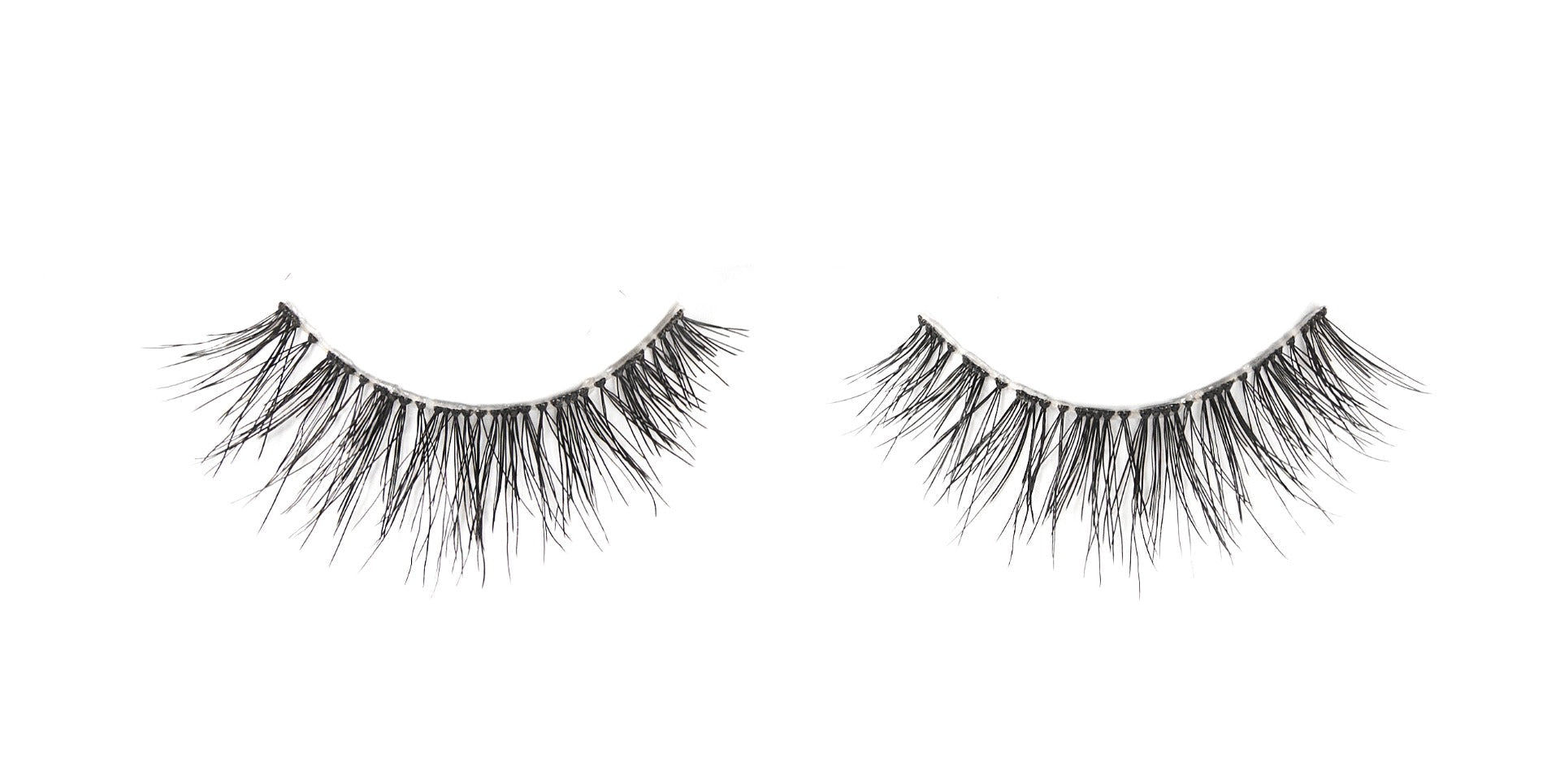 A single pair of Ardell Naked Lashes 425 featuring its multi-layered & short layered lashes isolated in white color setting