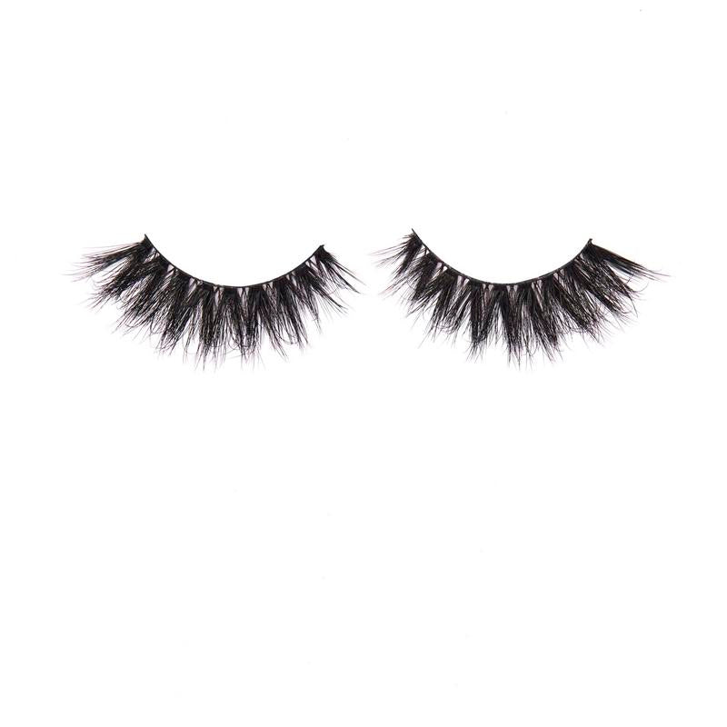 Pair of black false eyelashes on a white background